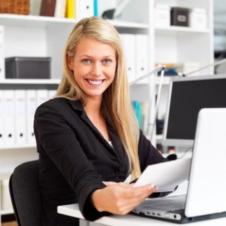 Portrait of a happy business woman working in office